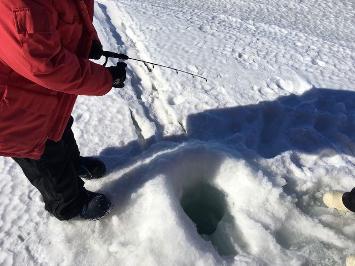 Denise Hardoy drops her line in to begin fishing.