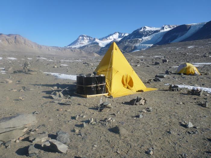 Two tents in a dry valley