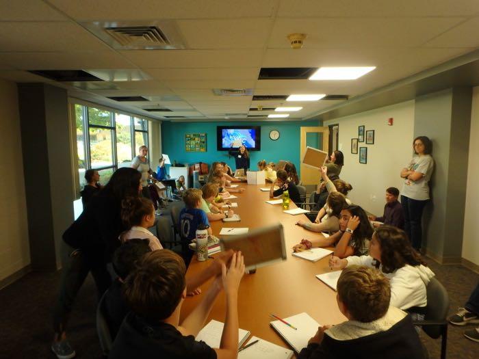 Amy Osborne presents information about her upcoming expedition to middle schoolers at The Logan School