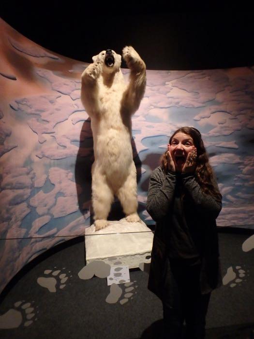 Amy Osborne and a polar bear at the Arctic exhibit