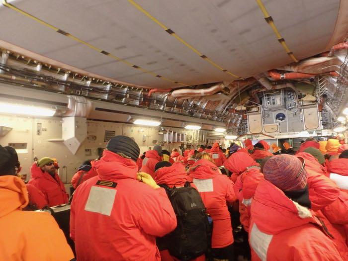 People getting ready to get off of the plane in Antarctica