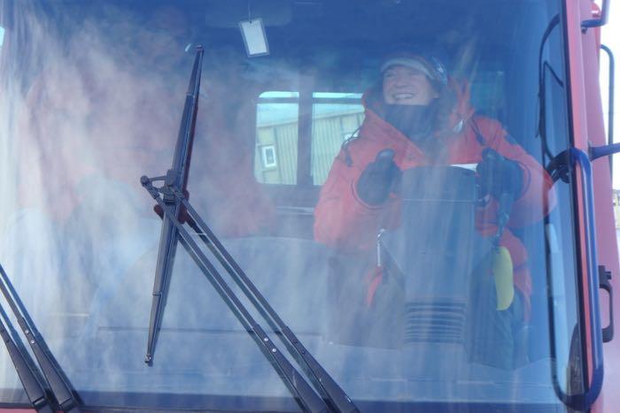 Amy Osborne in the driver's seat of a Pisten Bully.