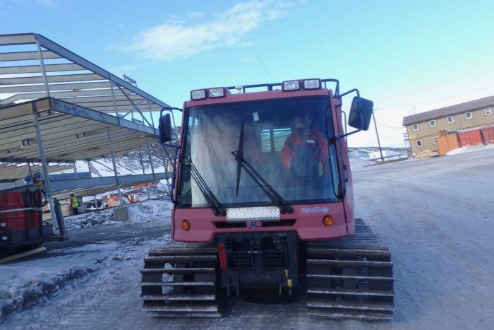 Amy Osborne in a Pisten Bully getting instructions from Tony.