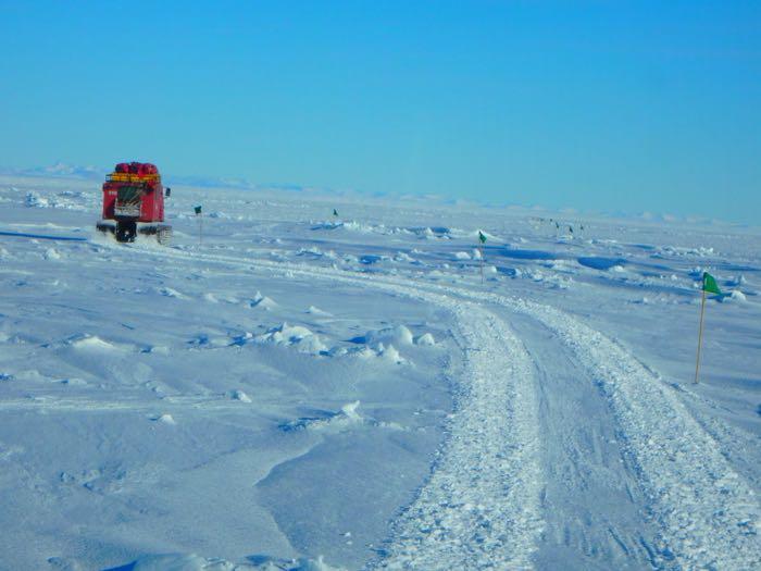 Pisten bully driving through rafted ice