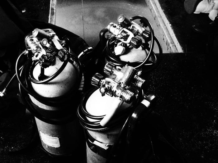 Oxygen tanks near a dive hole