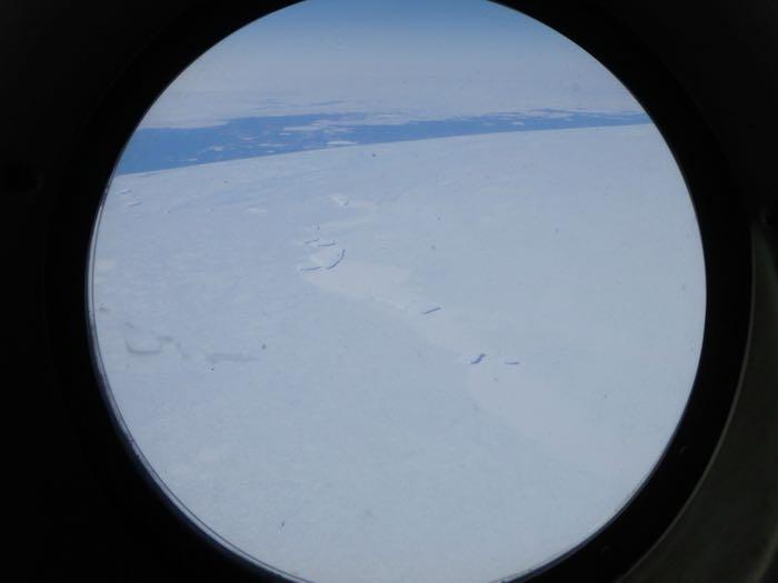 Mountains, icebergs, and sea ice with the ocean.