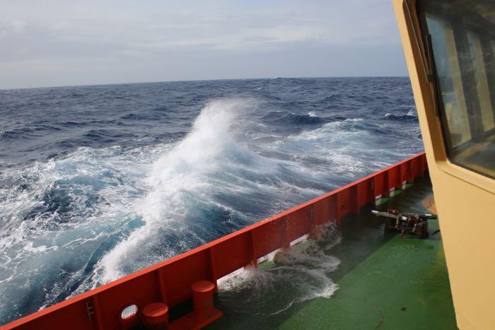 Waves crash on the starboard aft deck of the Palmer