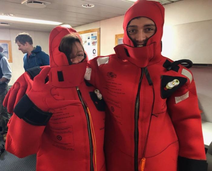 Passengers on the Nathaniel B. Palmer try on their float suits