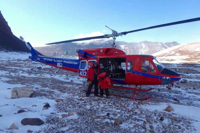 Kevin Dickerson and Dr. Byron Adams load into a Bell 212 helicopter to depart University Valley, Antarctica.