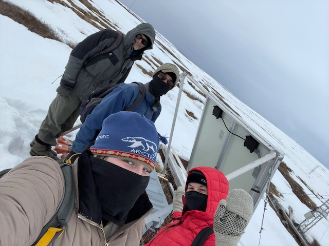 Liza stands in the snow with Steve, Jeremy, and Sarah. 