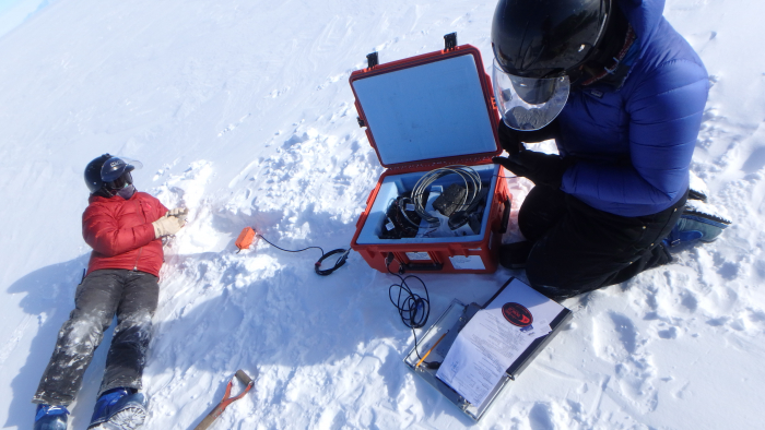 Gordon and Lynn work to install geophones out on the ice shelf.