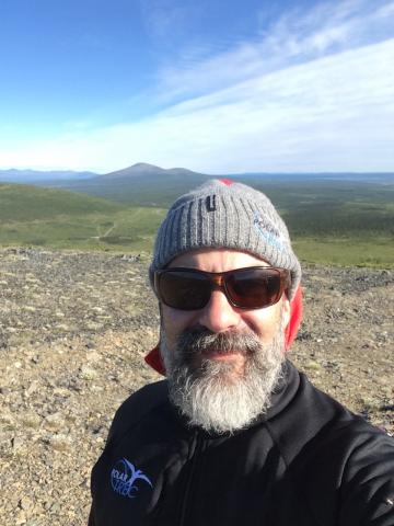 Stanley Skotnicki on top of Rodinka mountain in Cherskiy, Russia