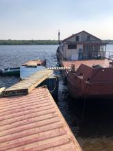 Shipping containers bridge the gaps to the barge