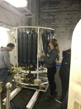 Eric Wisegraver (NOAA) and Caitlin Meadows, a PhD student, begin to collect water samples from the deep cast CTD.