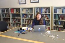 Amy Osborne working at her computer in the Crary Lab library.