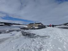 wooden hut in snow and ice