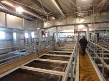 Inside of waste water treatment facility. Large tanks that hold waste water