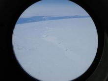 Mountains, icebergs, and sea ice with the ocean.