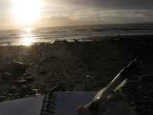 Journal, pen, and beach sunset