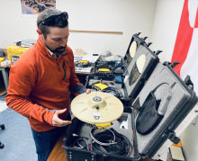 Dr. Seth Campbell (PolarTREC 2013) of the University of Maine, helping me understand technology used to monitor subglacial meltwater.