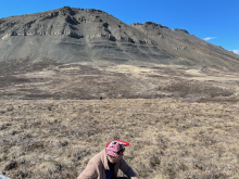 Sarah sits in front of Slope Mountain.