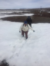 Liza and Steve walking through snow. 