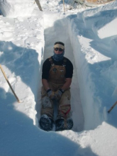 Corey in snow trench.  