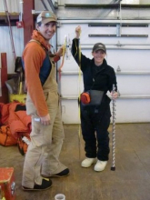 Holding up the sea ice measuring tape and line