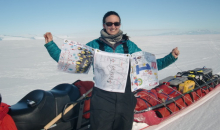 Dr. Michelle holding flags