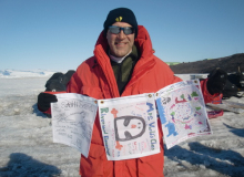 Gregg holding flags