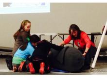 Students practicing weighing a Weddell seal.