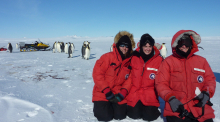 Researchers with Emperor penguins