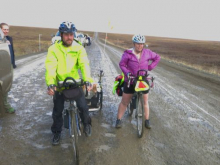 cyclists with dog