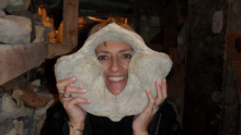 Anne Marie Wotkyns  holds a whale vertebrae