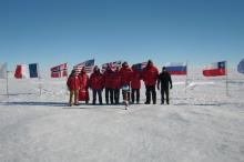 The IceCube team at the ceremonial South Pole.  The third from the right is me.