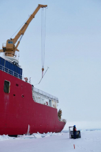 Ice mass balance buoy lowered to ice