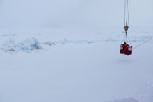 Lowering onto the ice in man basket