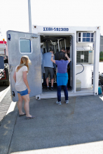 Unloading Gear from a Science Van