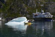 Bergy Bit, Kayaker, and NG Explorer, Skjoldungesund, Greenland