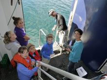 Gathering water column data at the side gate of NG Explorer