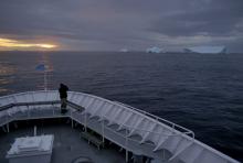 Joe Super and icebergs, sunset, South Greenland