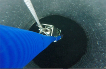 Looking Down Ice Hole at Beryllium Sampling Apparatus