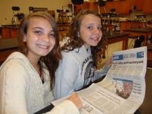 Addie and Andrie reading the paper