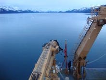 A member of the Coast Guard retired the colors while the Healy was in Seward.