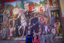 Graham students in front of mural