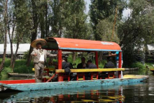 A mariachi on a passing Trajinera at Xochimilco