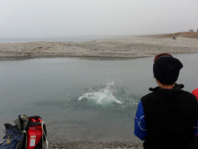 Jordon jumps in the water to retrieve the zodiac