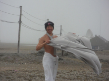 Jeremy standing in the wind after his swim.