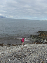 Cheryl on the beach ready for a dip.