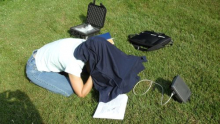 Claude Larson trying out her satellite phone on a sunny day.  